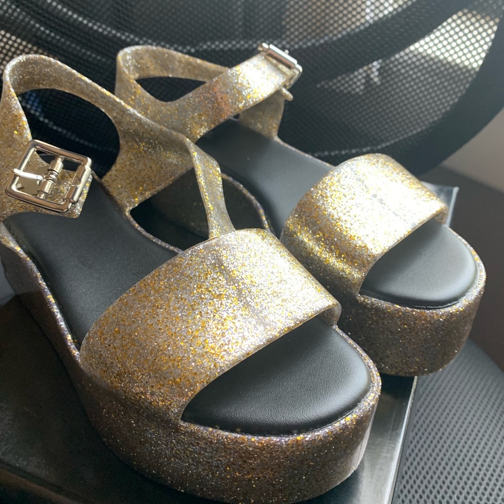 Melissa Brand new with box. Champagne Glitter.